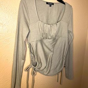 Greyish//greenish body on shirt